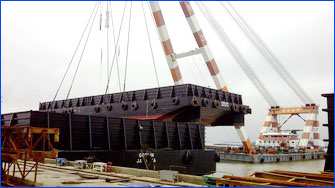 Load small barge to big barge with crane
